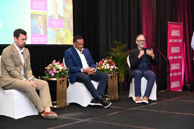 Kristopher DaCosta (centre) of the Jamaica Tourist Board and Accenture’s Dean Challis listen to RochHouse Hotel’s owner Paul Salmon (right) during a forum on artificial intelligence at the recently concluded JAPEX in Ocho Rios, St Ann.