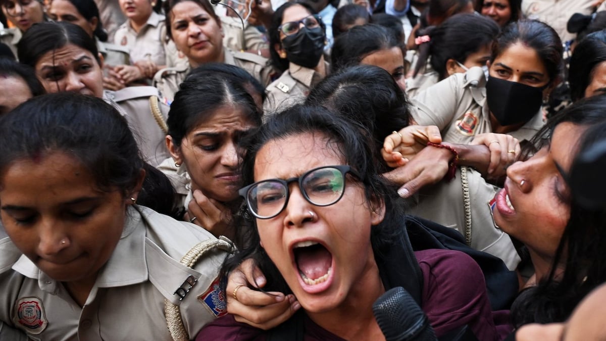 Crowds throng New Delhi and wave Indian flags amid escalating protests