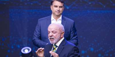 Lula e Fl&aacute;vio Bolsonaro durante debate da Band Foto: BRUNO MOTTA/ENQUADRAR / Estad&atilde;o