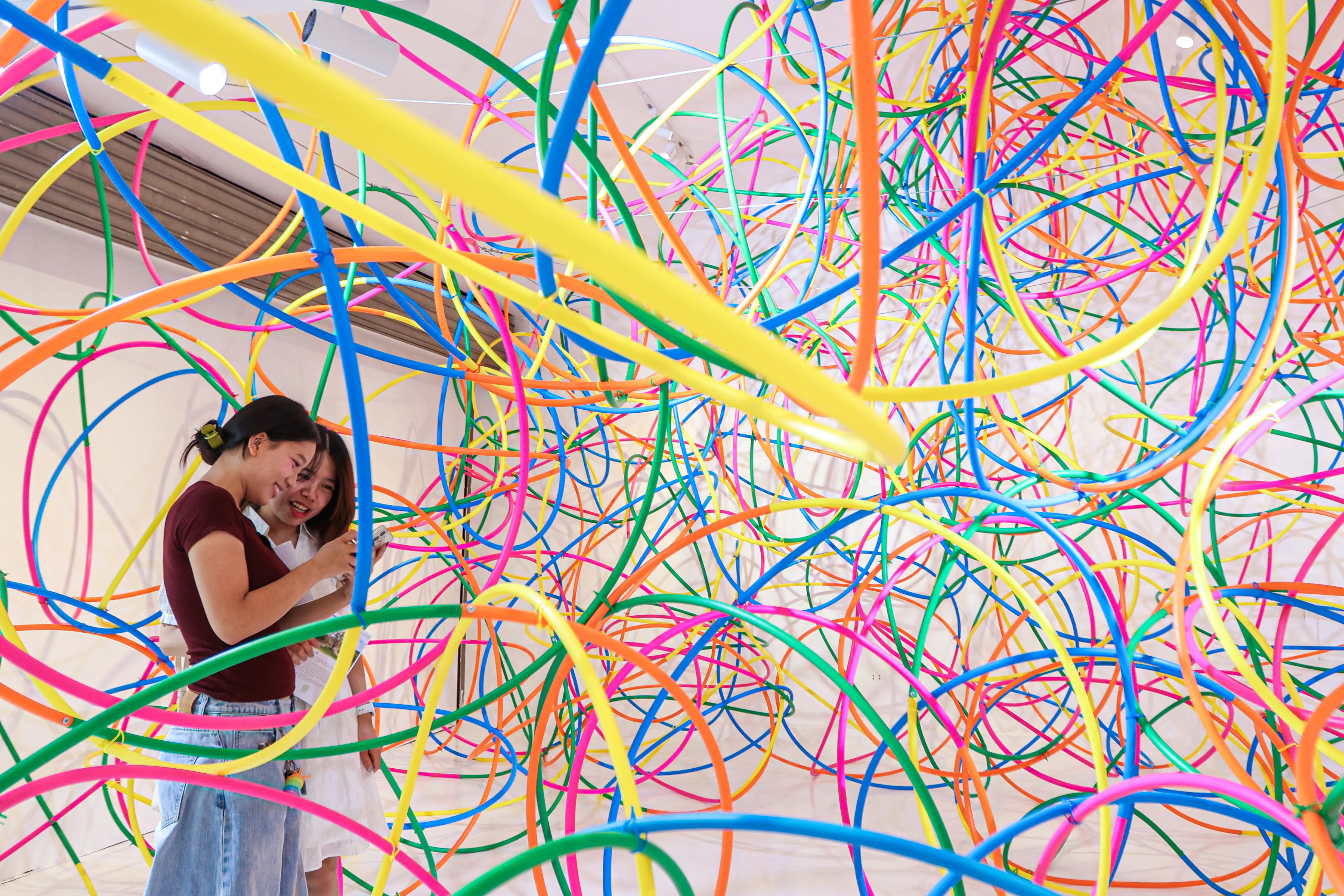 epa13321638 Visitors explore the 'Spinning Ghost Colors' exhibition in Hanoi, Vietnam, 22 October 2026. The installation exhibition by Japanese contemporary artist Kito Kengo is open at the Japan Foundation Center for Cultural Exchange, from 09 October to 06 December 2026. EPA/LUONG THAI LINH